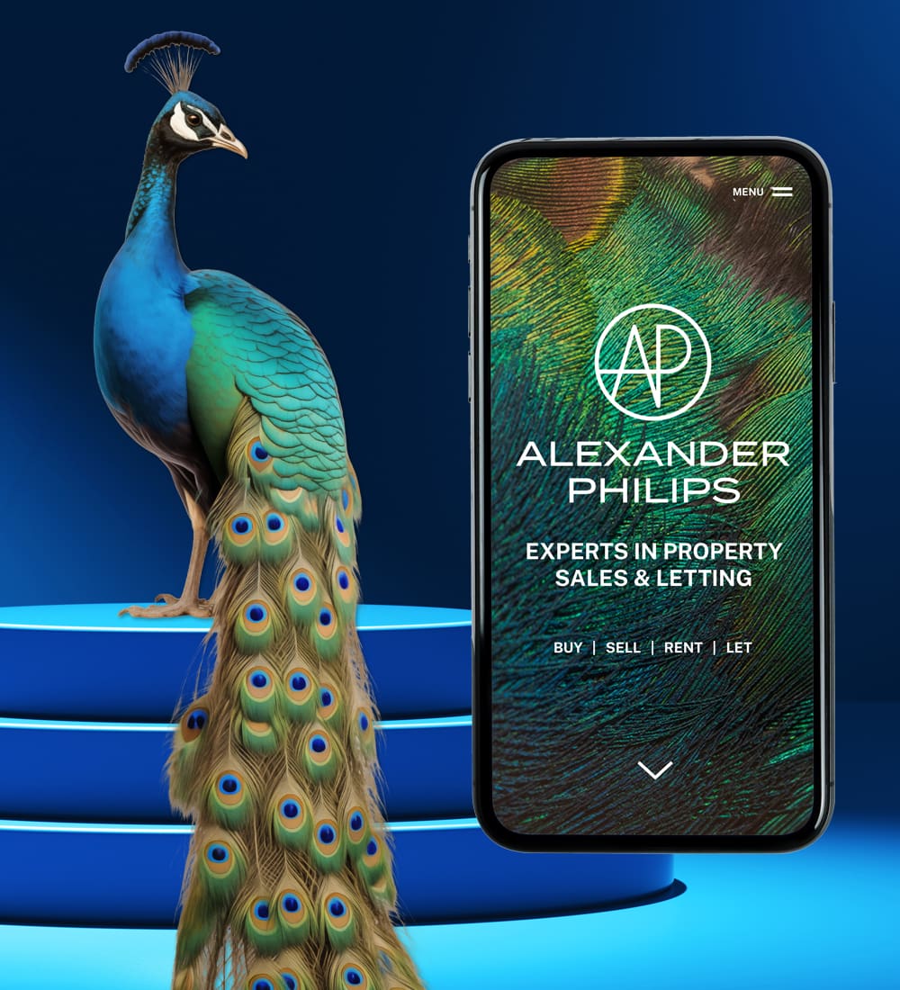 a colourful peacock standing on some steps alongside a mobile screen showing the alexander philips website